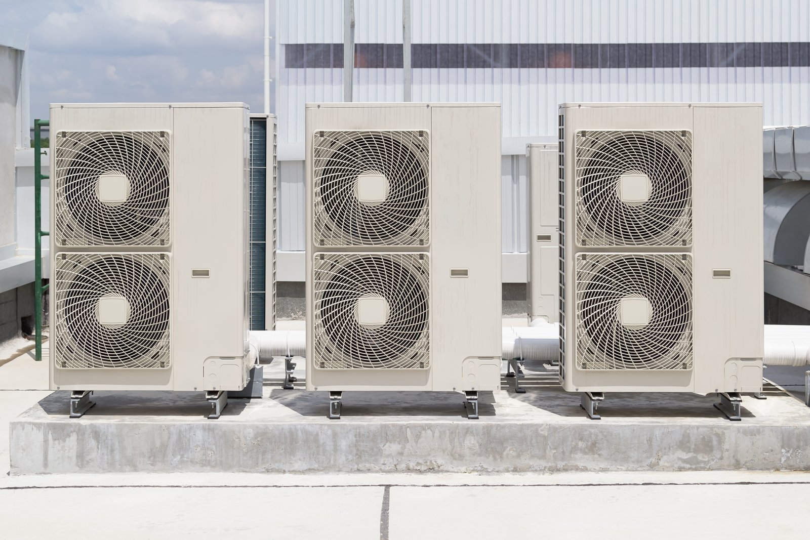 Large commercial HVAC outdoor units installed on a rooftop, ensuring efficient climate control for a building.