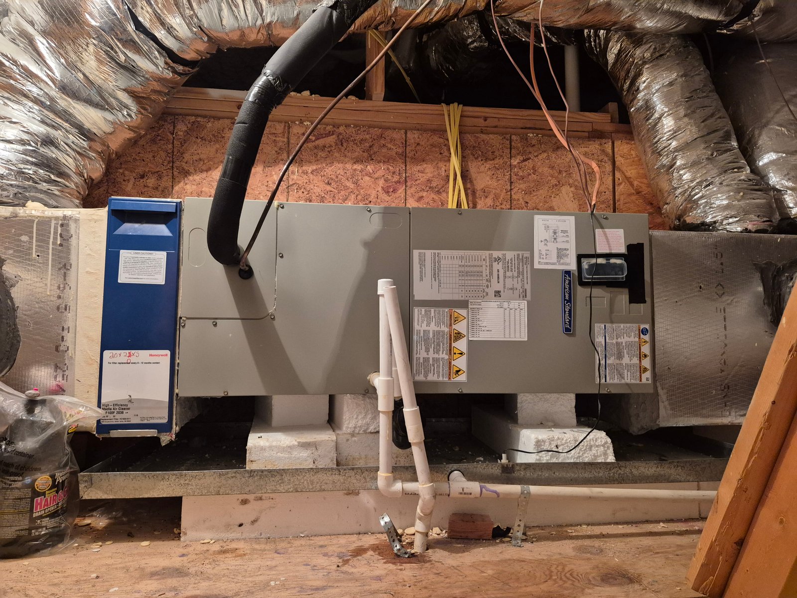 Wall-mounted split air conditioner in a modern interior, actively cooling the room with fresh airflow.