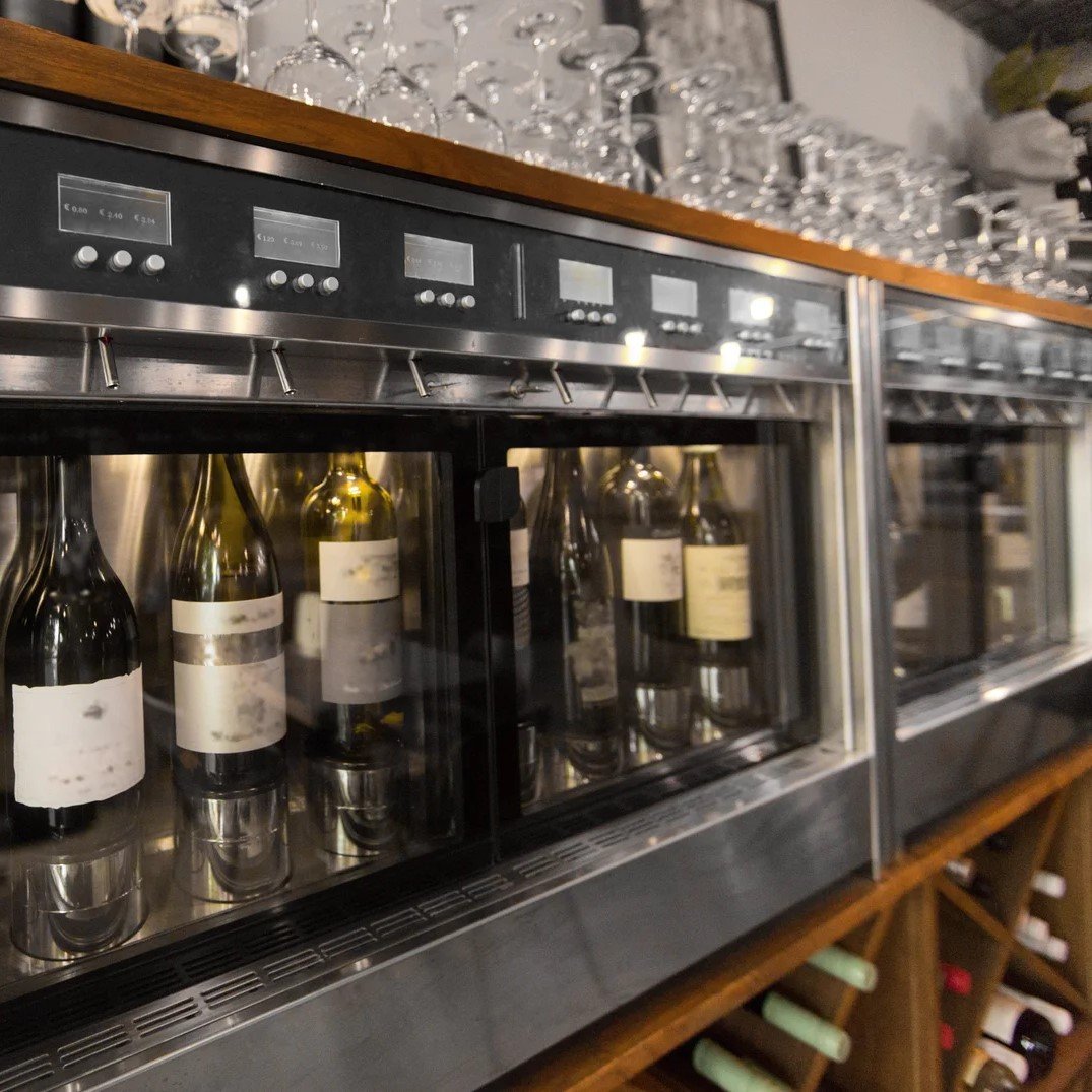 Technician inspecting a wine cooler system.